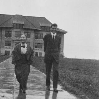 1900s photo of two people outside Sterry Hall